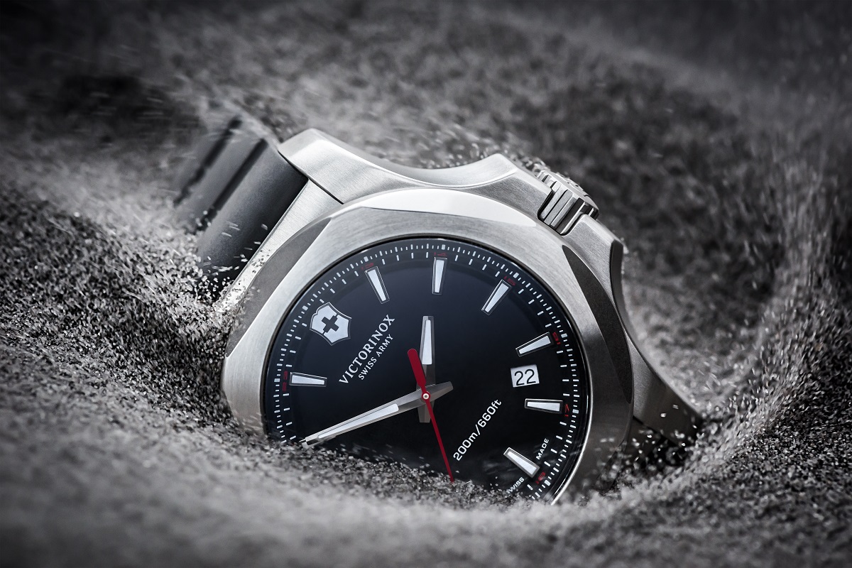 A watch in the sand, perfect for the beach - Victorinox I.N.O.X.