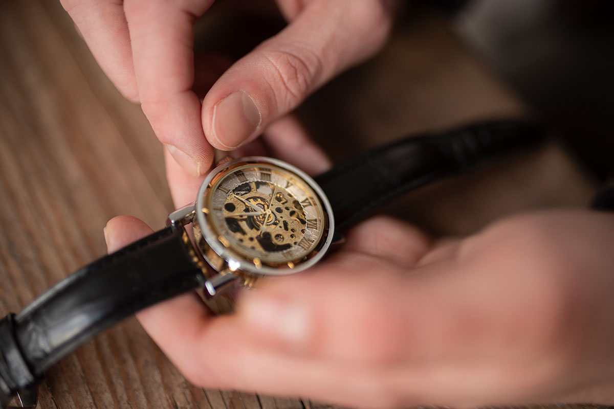a watch in the watchmaker's hands