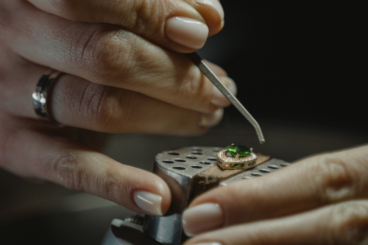 a jeweller polishing an emerald